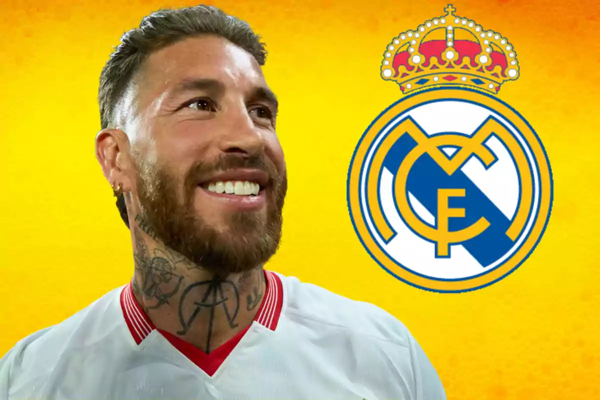 Un hombre sonriente con barba y tatuajes en el cuello, vistiendo una camiseta blanca, con el escudo del Real Madrid sobre un fondo amarillo.