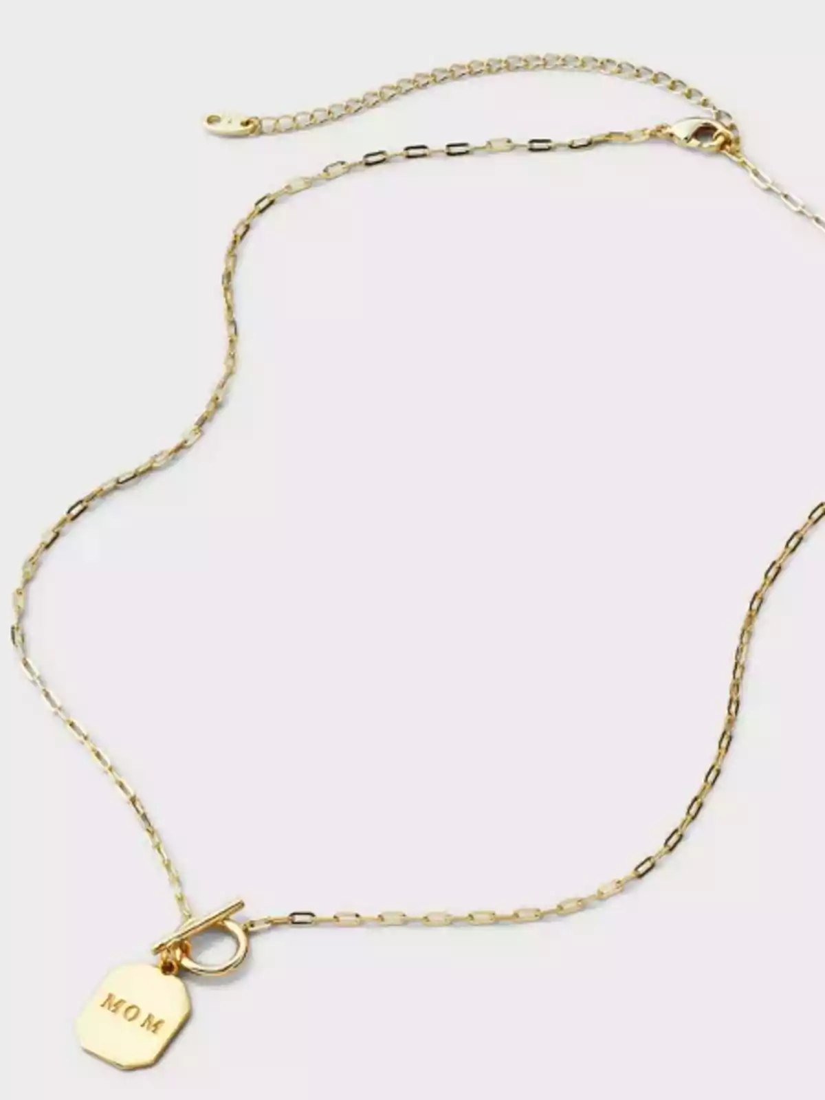 Gold chain necklace with an octagonal pendant engraved with the word Gold chain necklace with an octagonal pendant engraved with the word