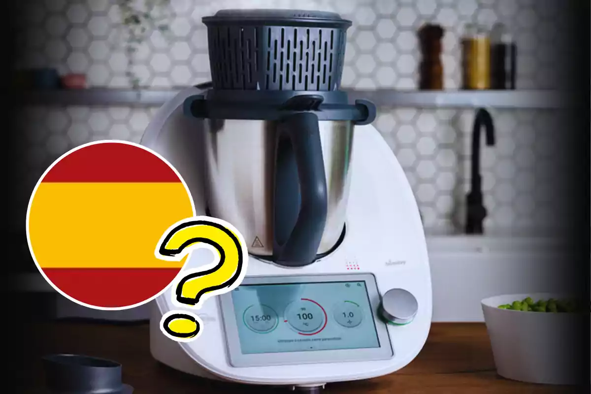 Una máquina de cocina con una pantalla digital en una encimera de cocina y un gráfico de una bandera española con un signo de interrogación.