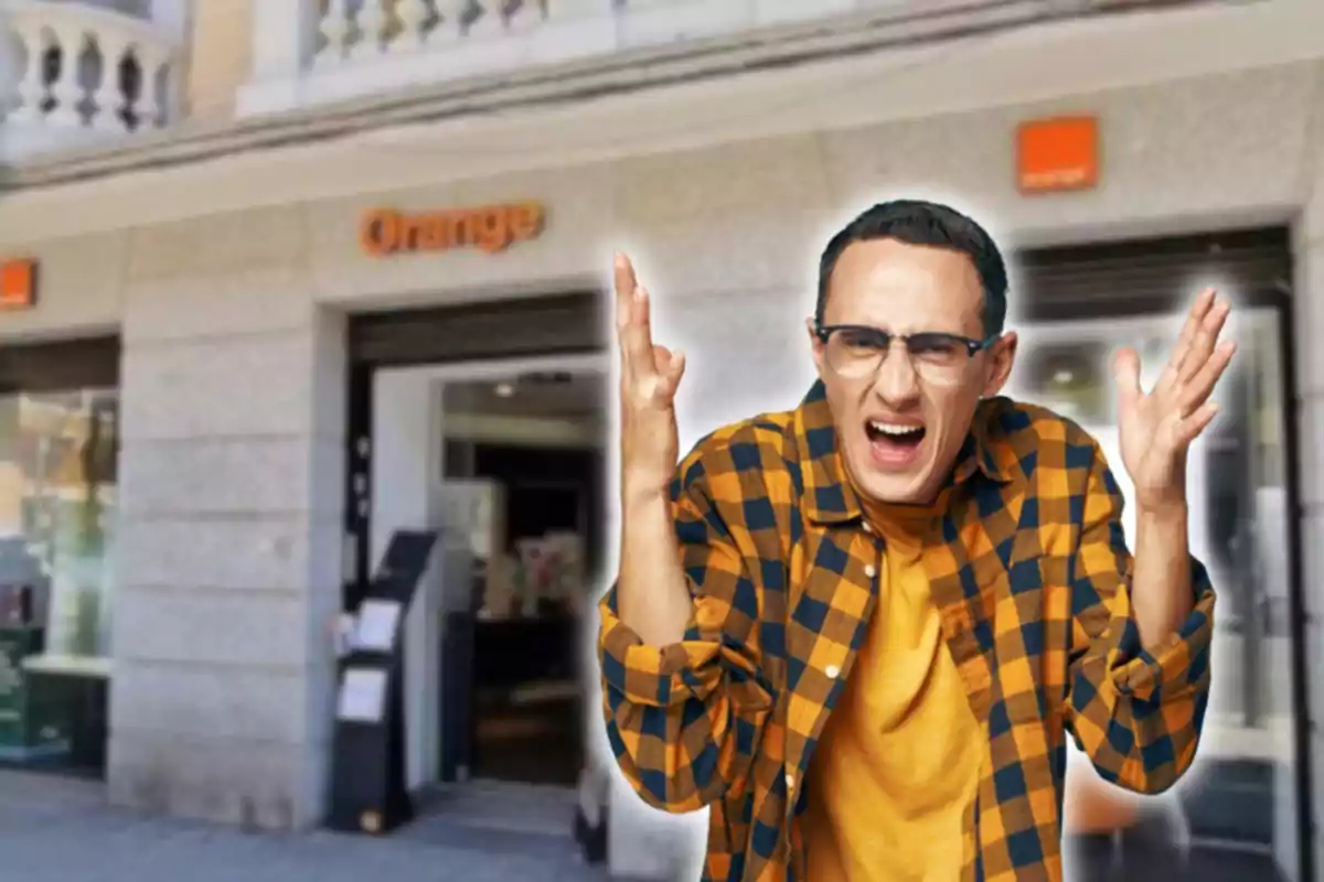 Man with plaid shirt and expression of frustration in front of an Orange store.