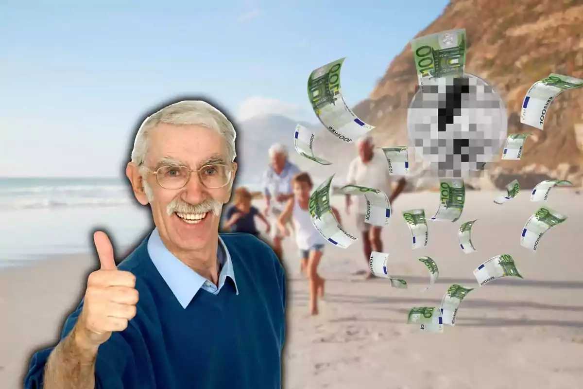 Hombre mayor sonriendo y levantando el pulgar con billetes de euro flotando en la playa.