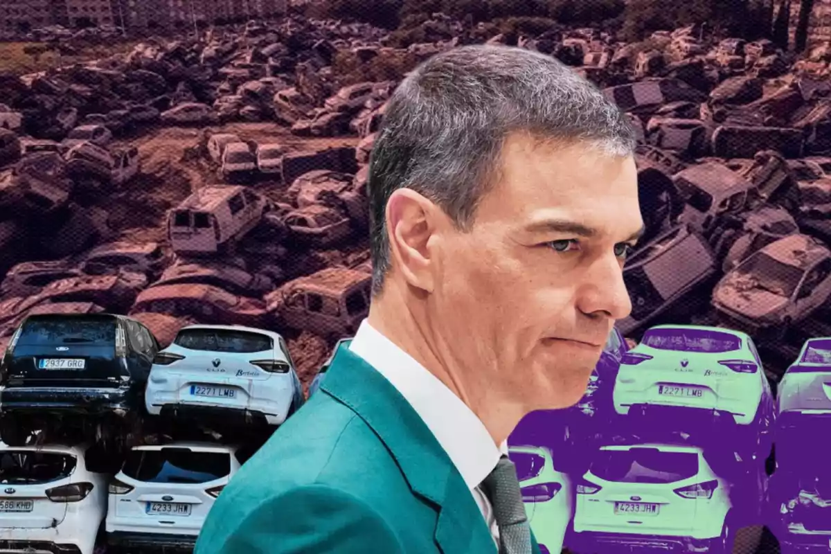 A man in a green suit appears in the foreground while numerous cars piled up in a junkyard can be seen in the background.