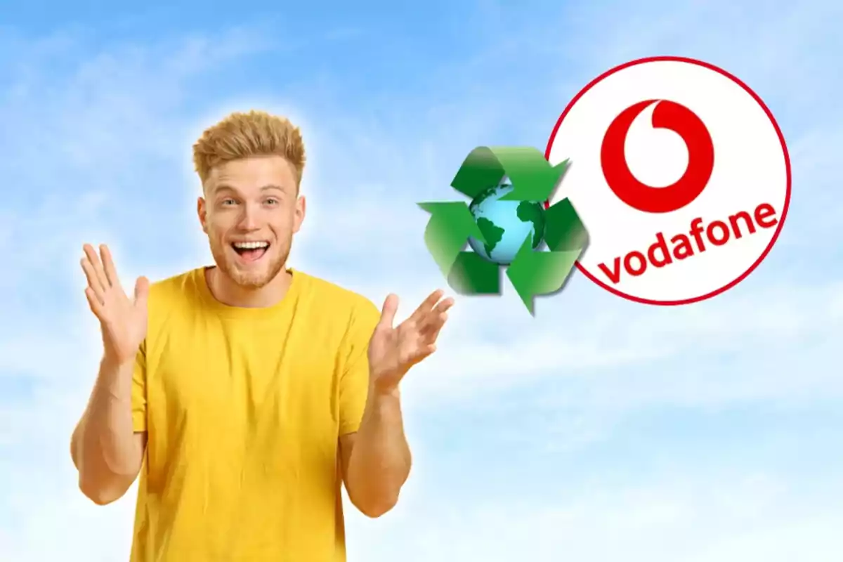 Hombre con camiseta amarilla sonriendo y levantando las manos, con un símbolo de reciclaje y el logo de Vodafone en el fondo. Hombre con camiseta amarilla sonriendo y levantando las manos, con un símbolo de reciclaje y el logo de Vodafone en el fondo.